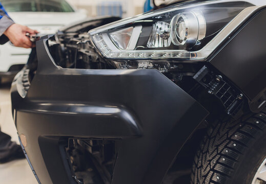 auto mechanic repair car body bumper replacement.