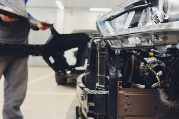 auto mechanic repair car body bumper replacement.