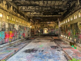Old, remote, abandoned building covered in grafiti 