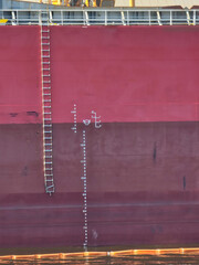 Embarkation pilot ladder and draught marks with Plimsoll Mark on large cargo ship