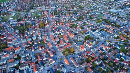 Aerial around the village Laichingen in Germany on a sunny afternoon in Autumn	
