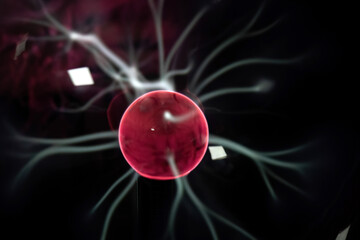 Close-up of a plasma ball with numerous bright white filaments extending toward the glass surface,...
