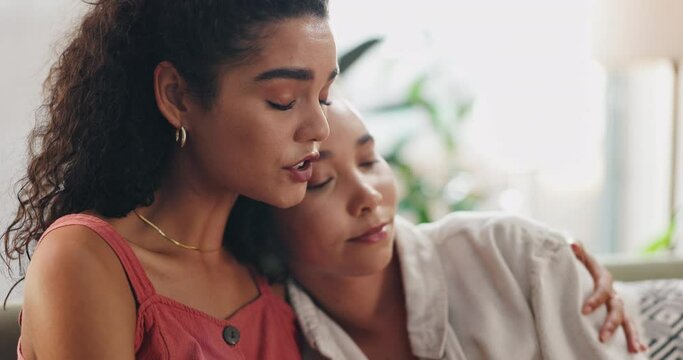 Friends, talking and hug for comfort in home, divorce or breakup with touch for care on weekend. Women, communication and embrace on couch with support, empathy and listening ear for mental health