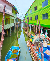 Fototapeta na wymiar The boats between stilt houses, Ko Panyi village, Phang Nga Bay, Thailand