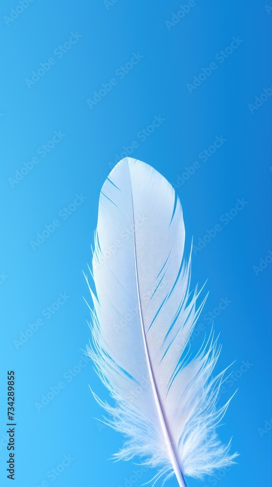 Poster a close up of a white feather on a blue sky background with only one feather left in the foreground.