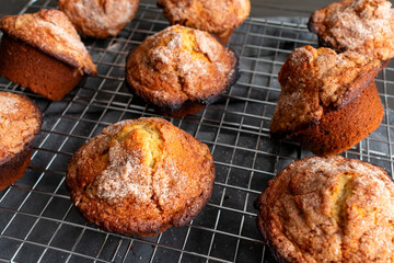 Banana Cinnamon Muffins Cooling on a Wire Rack: Freshly baked muffins topped with cinnamon and sugar on a wire cooling rack