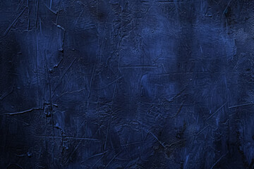 Dark blue textured surface with visible scratches and marks.