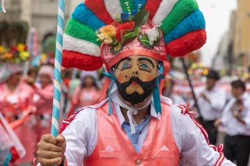 Papier Peint photo Lavable Carnaval Dancers of the Ancash region with their typical costumes in the parade in the historical center of Lima, Peru.