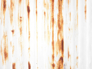 Rusted metal background with streaks of rust.