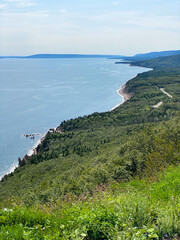 Obraz premium The Cabot Trail, a scenic highway on Cape Breton Island in Nova Scotia, Canada. Rugged coastline in the Cape Breton Highlands and the Cape Breton Highlands National Park.