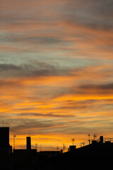 Fototapeta na wymiar Golden, orange and blue clouds at sunset