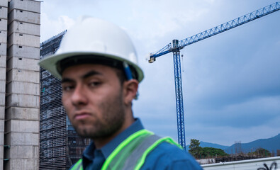 Construction worker man portrait in construction site in sunny day