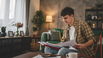 young caucasian man student study at home learn exam or prepare lesson