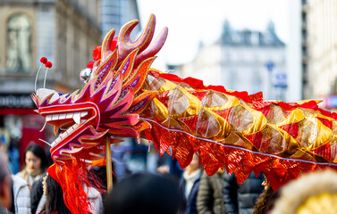 Dragon dance during Chinese lunar year celebrations in London, England - obrazy, fototapety, plakaty