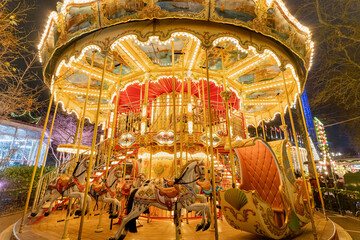 Glowing carousel with horses. Overall plan. © liukovmaksym