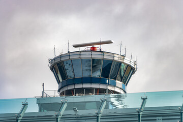 Control tower with rotating radar at the airport © milkovasa