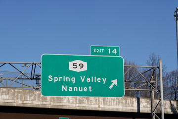 sign on I-287 I-87 NY State Thruway in Nanuet, New York for Exit 14 for NY-59 to Spring Valley and Nanuet