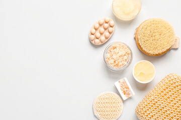 Scrub with sea salt, brush and sponges on white background. Body massage concept