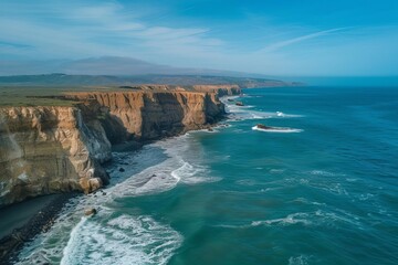 Fototapeta na wymiar Drone aerial view of a dramatic ocean landscape with waves crashing against cliffs. majestic natural scenery for adventure and exploration