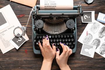 Woman typing on typewriter and criminal files on wooden background - obrazy, fototapety, plakaty