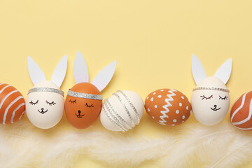 Composition with creative Easter eggs on beige background