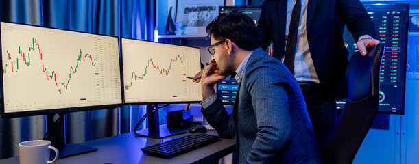 Stock exchange traders looking on high profit chart investment in panorama view, analyzing on...