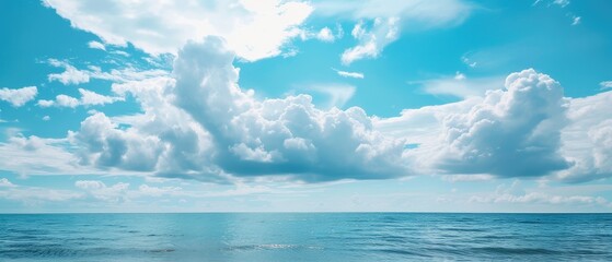 Serene Blue Sky and Fluffy Clouds Over Ocean