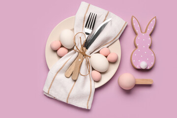 Stylish table setting with Easter eggs, napkin and cutlery on purple background