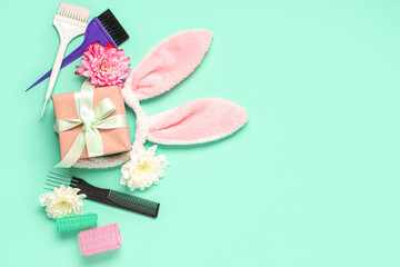 Composition with hairdresser's supplies, bunny ears and gift on color background