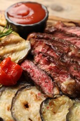 Delicious grilled beef with vegetables on table, closeup