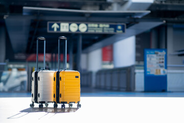Travel, Two suitcases in an empty airport hall, traveler cases in the departure airport terminal...