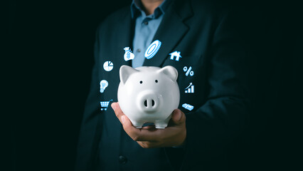Close-up Of Businessman Hand holding white Piggybank, Financial planning and saving money, Money...