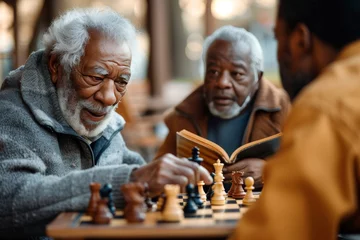 Tuinposter In a quiet indoor setting, a group of senior citizens engage in a strategic battle of wits and concentration over a chessboard, their faces reflecting determination and focus as they manipulate the c © LifeMedia