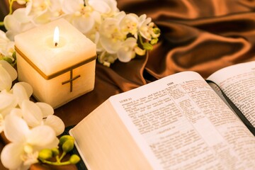 Fototapeta na wymiar Closeup of Open Bible and Candle