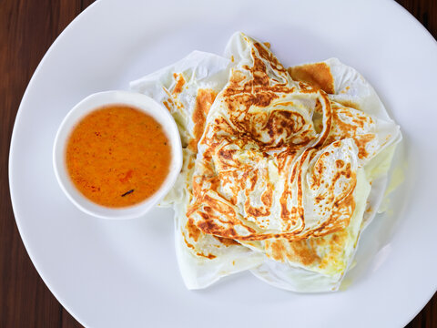 Roti Prata, popular Indian flatbread dish found in Singapore, Brunei, Indonesia and Malaysia. Asia, Asian traditional street food, made from flour bread from top view