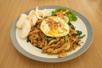 Kwetiaw or Kwetiau, fried rice noodles with meatballs and vegetables. Popular in Indonesia
