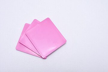 pink color chips isolated on a white background, these chips are examples of product colors...