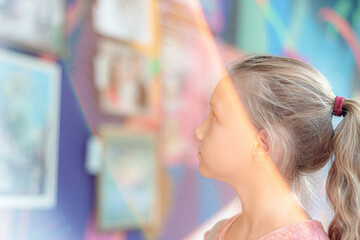 Girl at the exhibition of paintings, the cultural development of the young generation.