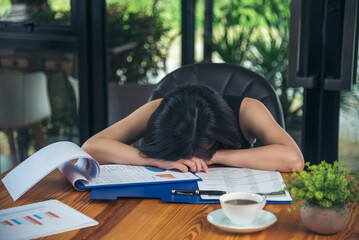 Desperate Asian woman stress headache depressed from startup small business at home office. Failure...