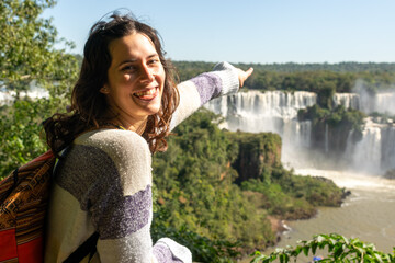 beautiful woman knowing the wonderful waterfalls
