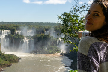 beautiful woman knowing the wonderful waterfalls
