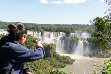 tourist indicating the falls