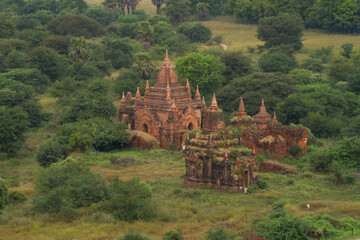 Fototapeta na wymiar Aerial top view of burmese temples of Bagan City from a balloon, unesco world heritage with forest trees, Myanmar or Burma. Tourist destination.