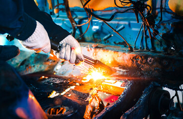 Close up hand heavy industrial worker is working on metal work factory process by Cutting sheet...
