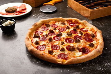 Brookln Pie or Brooklyn Pizza isolated on dark background with raw food top view of italian fastfood appetizer