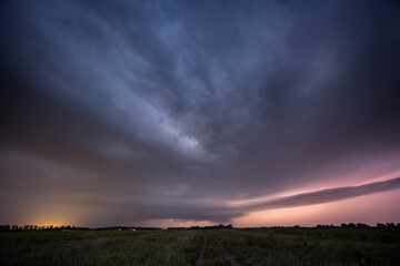 Supercell thunderstorm at night with lots of lightning