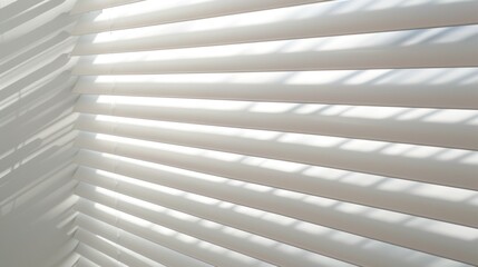 Obraz premium Sunlight streams through white venetian blinds, casting soft shadows in a tranquil room.