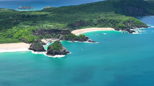 Sancho Beach At Fernando De Noronha Pernambuco Brazil. Aerial Beach Blue Sea. Coast Sky Clouds City Seaside. Coast South America City Beach Panning Wide. Coast Seaside Backgrounds Landmark.