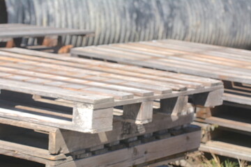 Abandoned pallets stacked together at the construction site