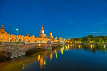 Berlin Germany, sunset city skyline at Oberbaum Bridge and Spree River
